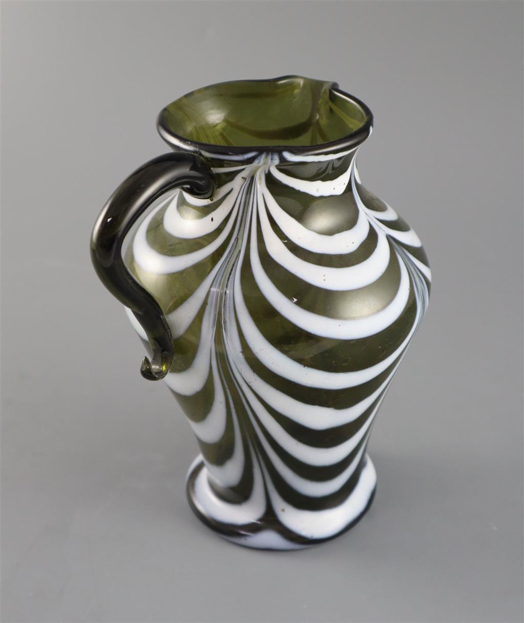 A George III green and white feather trailed glass jug, c.1800, 19cm high